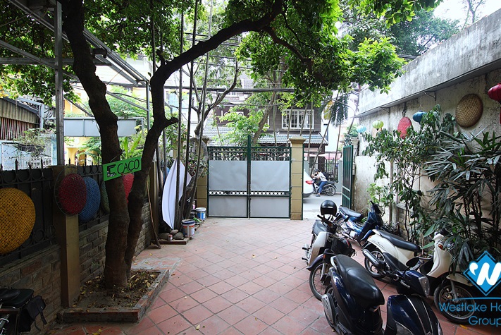 The first floor with two yards for rent for doing business on To Ngoc Van st, Tay Ho district